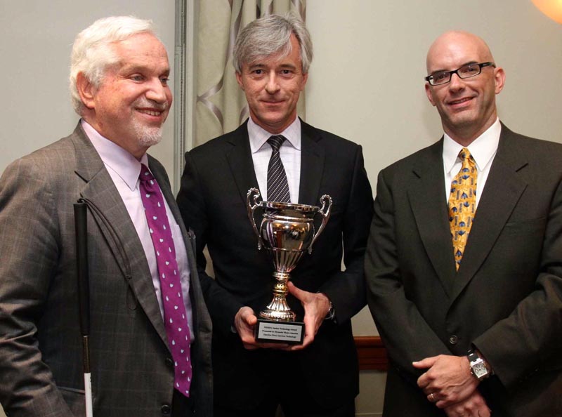 NEMPA members Paul Parravano, left, Co-Director of MIT’s Office of Government and Community Relations, and Craig Fitzgerald, Editorial Director of IMN, Inc., flank John Krafcik, CEO of Hyundai Motor America. Krafcik, an MIT alumnus, holds NEMPA’s Silver Anniversary Executive Award, presented to him for “his strong ties to New England as a Connecticut native, MIT Sloan School graduate, and for his sterling success in the automotive industry.” Krafcik also accepted The Yankee Cup Technology Award for his company’s Gasoline Direct Injection system.