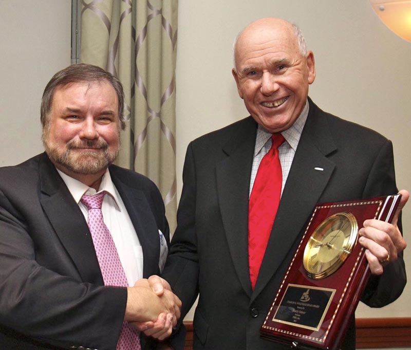 NEMPA’s John Lawlor, left, presents THE CHARLES E. DOLE HIGH ROAD AWARD to Marty Schorr, President, PMPR, Inc. This special award goes to “an automotive professional who has emulated the enterprise, collegiality, helpfulness, integrity and good will that marked the career of Charlie Dole, for many years the automotive columnist for theChristian Science Monitor and dean of the New England automotive press corps.”