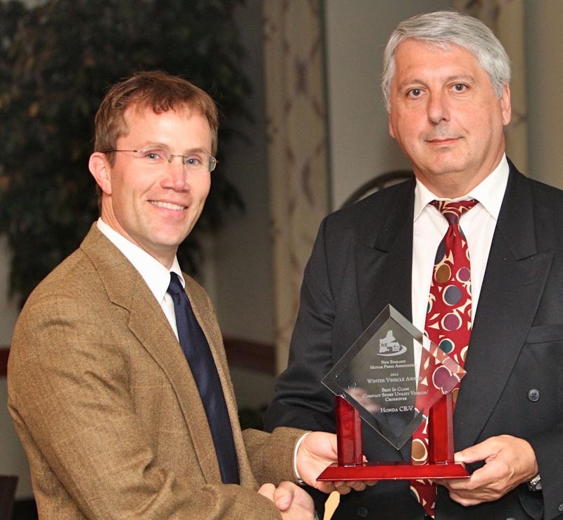 Honda’s Chris Naughton accepts the BEST IN CLASS—COMPACT SPORT UTILITY VEHICLE/CROSSOVER award for the Honda CR-V from John Paul. The CR-V helped launch the non-truck-based SUV segment that came to be known as crossovers back in the 1990s. Honda hasn’t been sitting on its laurels, however, and the CR-V was redesigned for 2012. Offering a newly refined and efficient engine, more space and excellent driving dynamics, the CR-V offers compact all-weather excellence at an affordable price. Many families have been lured to smaller SUV and crossover vehicles by exactly the sort of thoughtful interior design and functionality that Honda has included in the 2012 CR-V. There’s lots of storage and a low liftover height, and the sophisticated available hands-free navigation and connectivity system reads text messages aloud. The Honda CR-V parlays its successful redesign into a spot as a top 2012 Winter Vehicle.