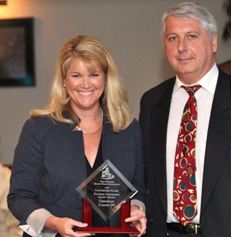 GM’s Laura Toole accepts the award for BEST IN CLASS—PREMIUM SPORT UTILITY VEHICLE/CROSSOVER on behalf of the Cadillac Escalade, judged one of the pinnacles of luxury full-size sport-utility vehicles. The Escalade has earned this recognition over 13 years of crashing the luxury SUV party with a unique look and a red-blooded American V8. Efficiency goes hand-in-hand with muscle, thanks to cylinder deactivation. A strong frame boosts towing capacity, while available all-wheel drive and Magnetic Ride Control give this big SUV athletic reflexes even in quickly changing conditions. A leather-lined interior filled with technology for both passengers and drivers clinched our Winter voting. The swashbuckling Cadillac Escalade has the right stuff for the New England buyer looking for a premium package of all-season capability, capacity and comfort.