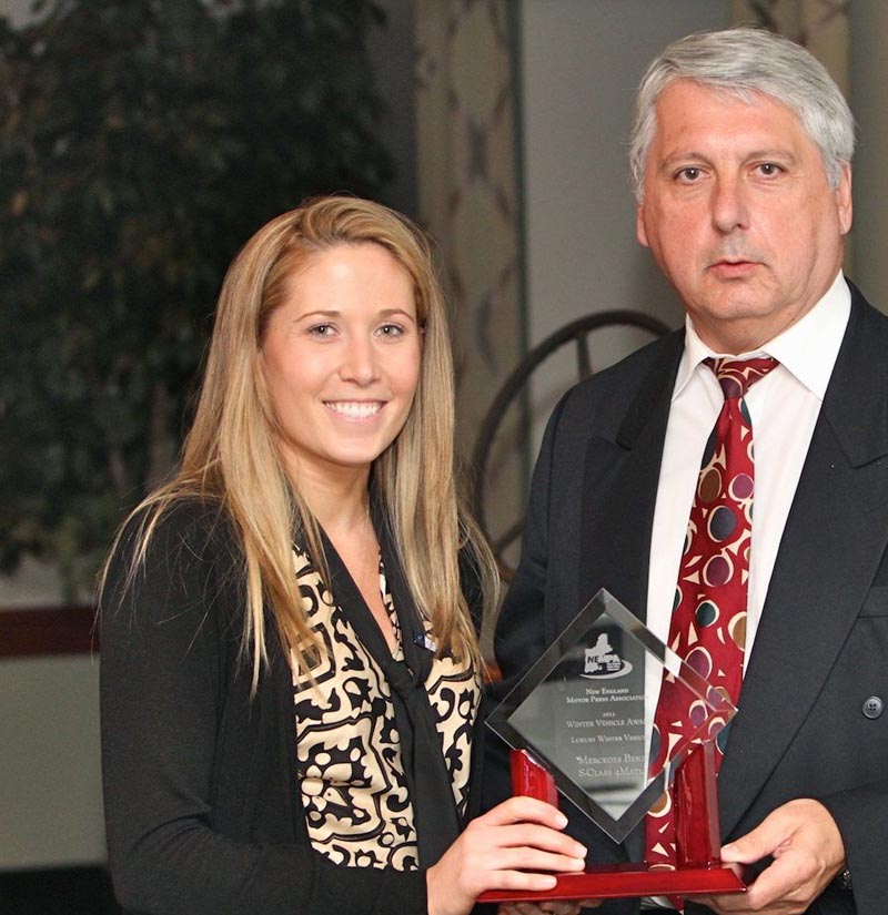 Lindsay Burns, M-B USA, accepts the award for best LUXURY WINTER VEHICLE for the Mercedes-Benz S-Class 4MATIC from NEMPA’s John Paul. The S- Class is this storied automaker’s flagship sedan, with a reputation for quality, safety and leading-edge technology that has been forged over decades. All S- Class models feels girder-strong, and 4MATIC models drive all four wheels to further enhance that solidity with unflappable foul-weather capabilities. This formidable, luxurious, roomy sedan can be equipped with a wide range of powertrains, including a new S350 BlueTEC diesel and the S400 HYBRID, and every S-Class automobile offers leading-edge driver-aid and active and passive safety features. The S-Class 4MATIC is an ideal way to make progress regardless of what’s happening outside.