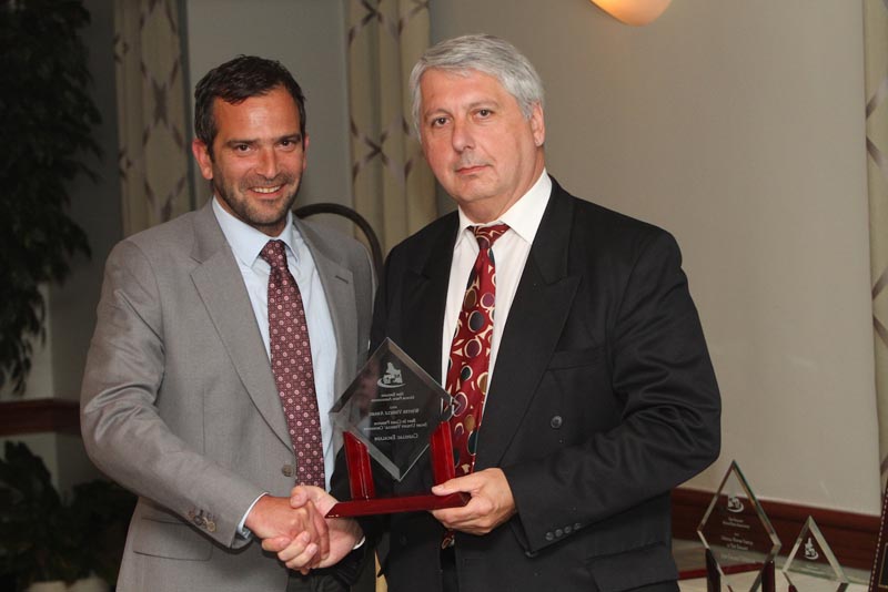 NEMPA V-P John Paul, right, presents THE CAMEL’S BACK AWARD to Pierre Kanter, President of FMI. This award gets its name from NEMPA’s penchant for often untimely and burdensome requests that could be the proverbial “straw that broke the camel’s back”—but that Pierre Kanter has cheerfully fulfilled time and again in his automotive career. Pierre also accepted NEMPA’s FAVORITE CONVERTIBLE $35,000-$50,000 AWARD for the Chevrolet Camaro SS. Many NEMPA members regard this Camaro as a contemporary interpretation of a classic design—and it has one of the best exhaust notes on the road. With up to 426 horsepower on tap and excellent handling, comfortable seats and other amenities, the Camaro SS puts Chevrolet back in the pony-car game in a big way.