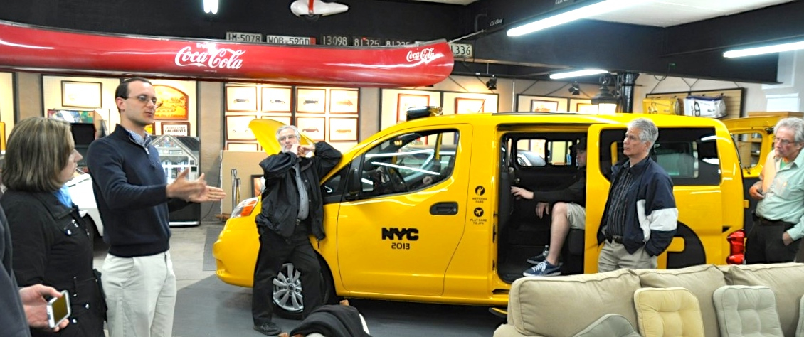 The canary-yellow taxi was sitting outside the Middleboro/Lakeville commuter rail station this raw and drizzly April night. It looked like it was hoping for a fare, but it was just being photographed by the media. A taxi? Well, yes—a brand-new Nissan taxicab, as adopted by New York. Sort of.