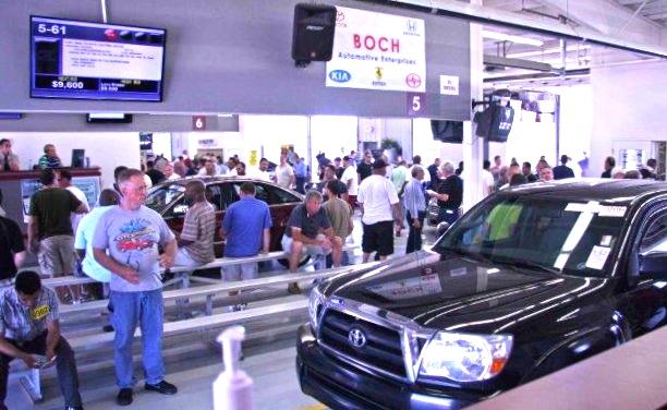 Visiting Manheim New England’s auto-auction facility during a sale has the feel of being at the track for a big stakes race.