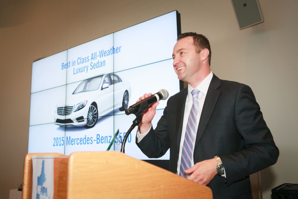 Rob Moran, Director, Corporate Communications for Mercedes-Benz cheerfully accepts the award for the "Best in Class all-weather Luxury Sedan" - Mercedes Benz S550