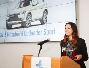 Victoria Van Guyse accepts the award on behalf of Mitsubishi at the 2016 NEMPA Annual Awards Dinner.