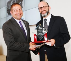 Alex Nunez accepting the award for Hyundai from NEMPA President, Craig Fitzgerald.